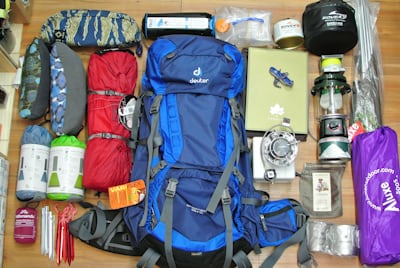 Essential camping gear laid out - solo camping gear essentials